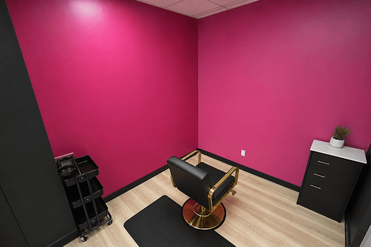 Corner view of pink salon suite with gold chair