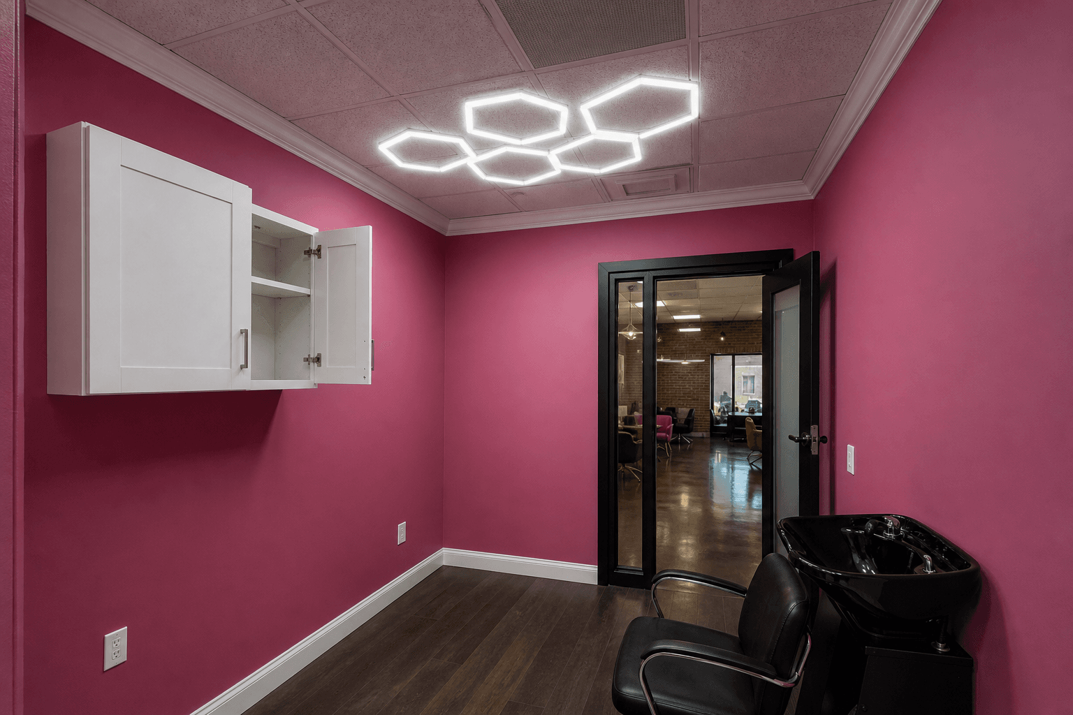 Premium salon suite with hexagonal LED ceiling and pink walls