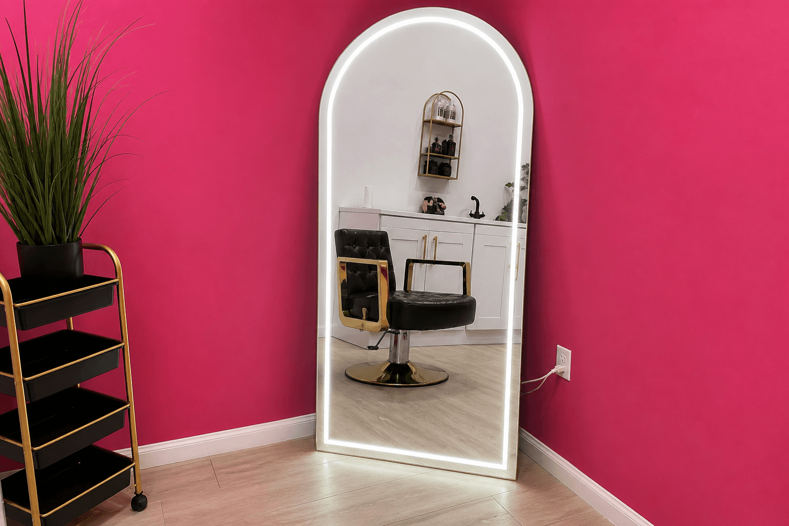 Salon suite with arched LED mirror and black gold styling chair